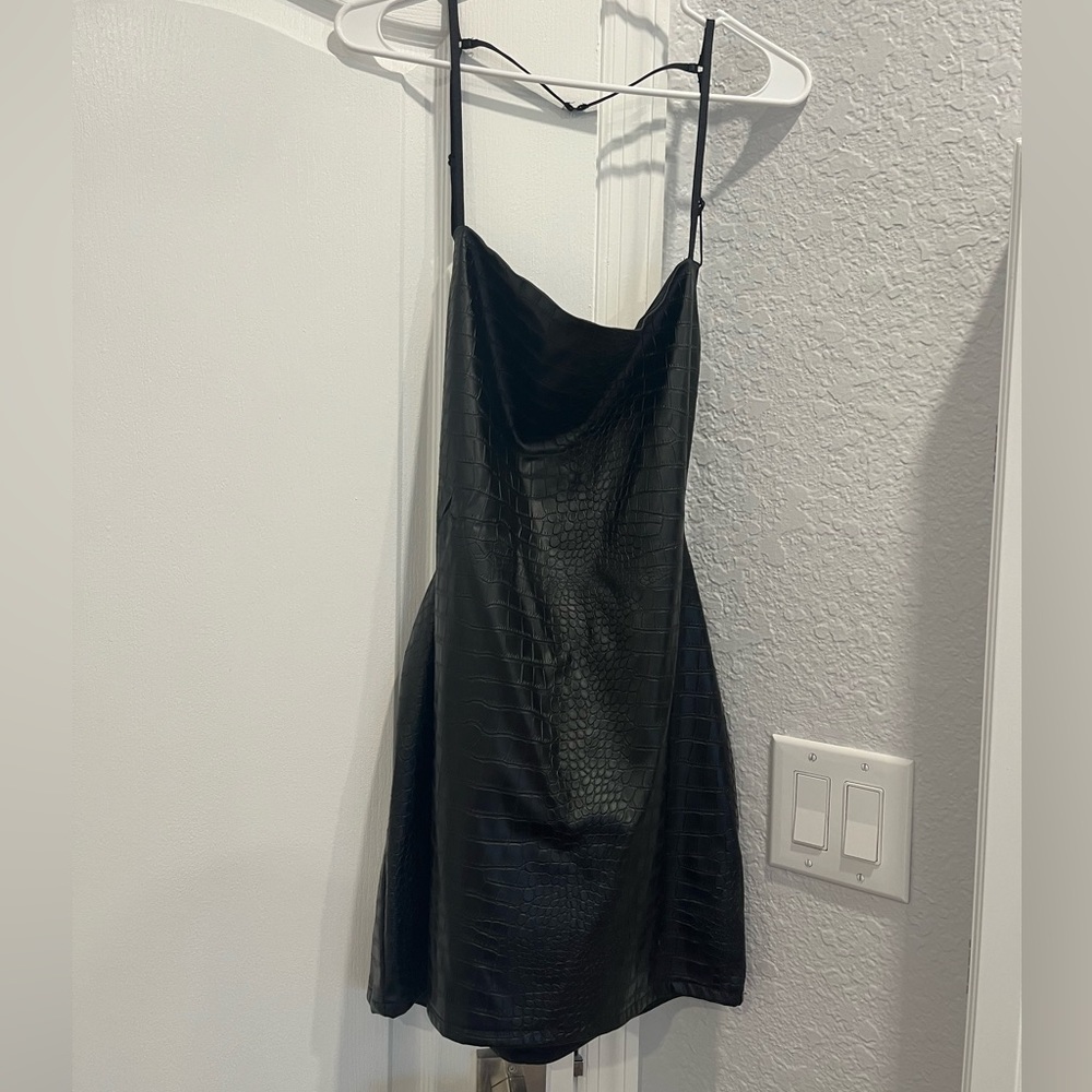 Snake print open back black dress